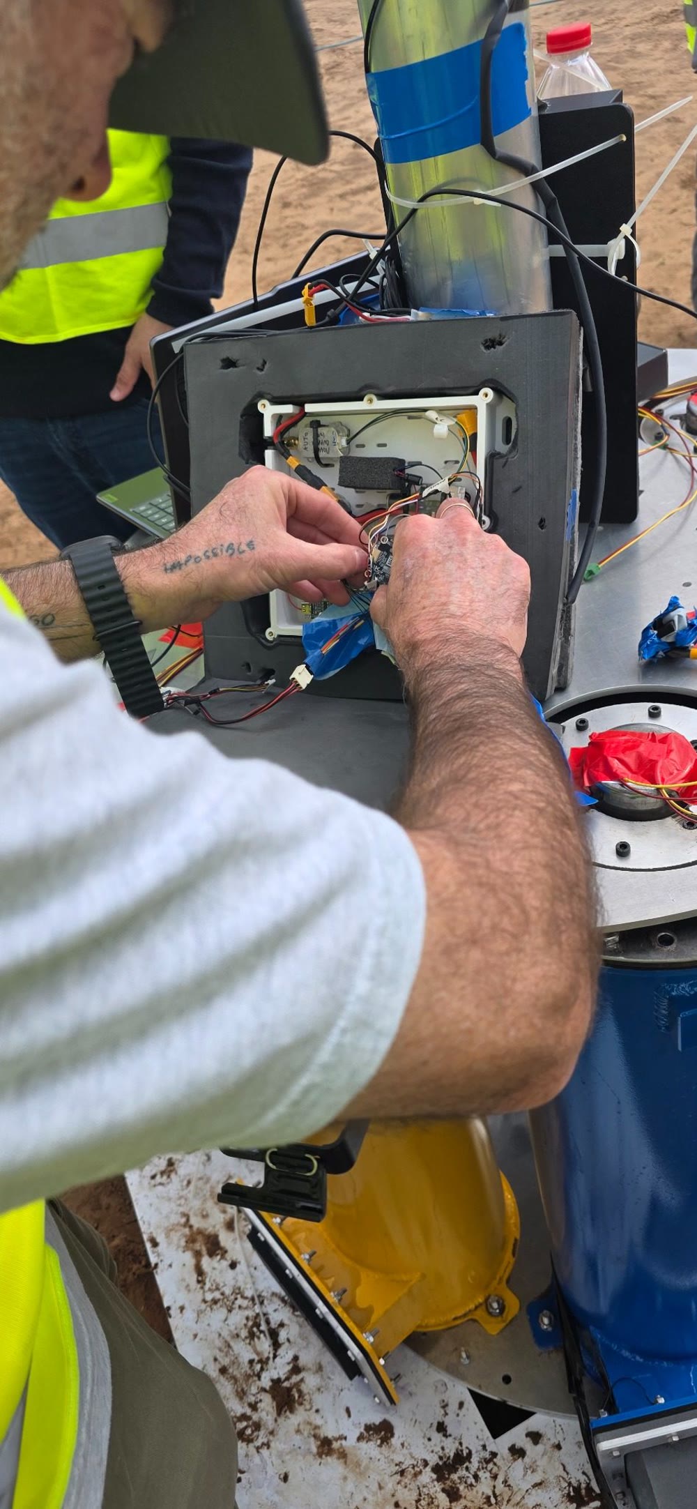 Engineers assembling hardware in the field