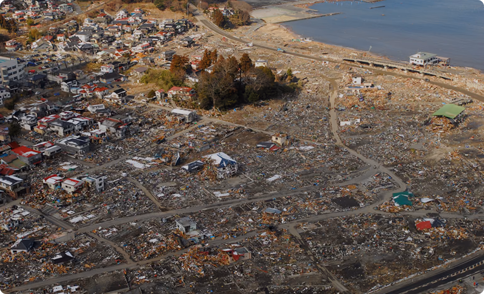 Aerial view of a coastal town damaged by a disaster